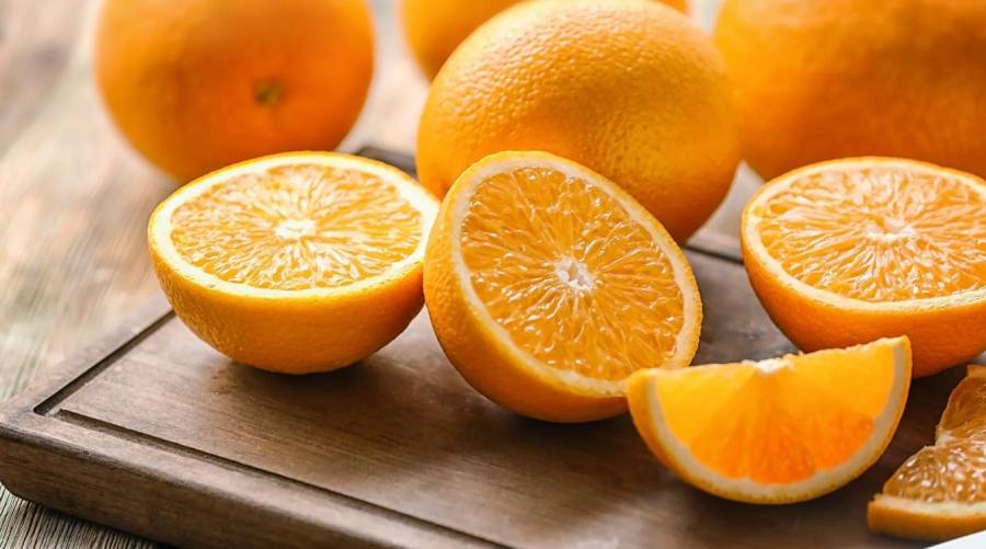 A close-up of fresh oranges, highlighting their vibrant color and juicy texture, representing their potential benefits in reducing depression risk.