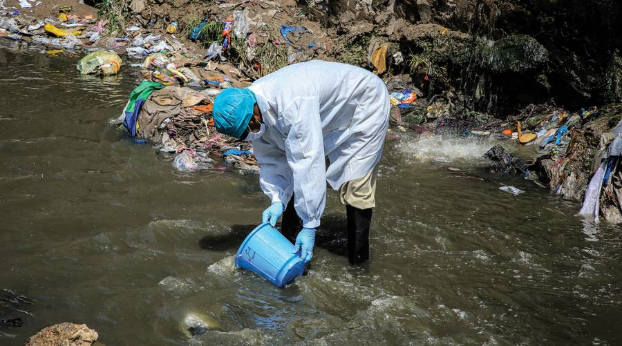 Image of sewage sampling in Pakistan highlighting polio surveillance efforts.